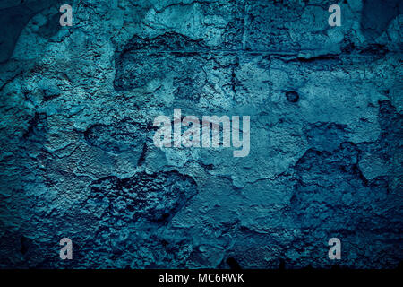 Grunge blue painted cracking wall concrete texture background. Stock Photo