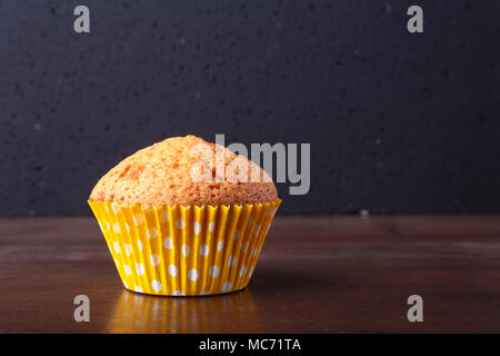 Tasty chocolate cupcakes, muffins on a white wooden table. Stock Photo