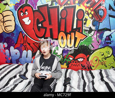 FILE--A young boy plays electronic games on an XBOX ONE game console at a  physical store of Microsoft in Shanghai, China, 26 December 2014. Produc  Stock Photo - Alamy