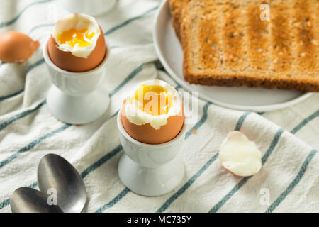 Homemade Soft Boiled Egg in a Cup with Toast Stock Photo