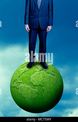 man standing on green earth, sustainable business and corporate social responsibility concept Stock Photo