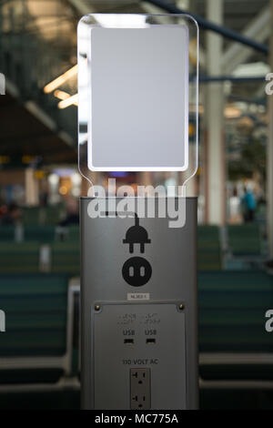 Electrical socket for digital devices airport background concept charging station Stock Photo