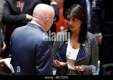 Untied Nations. 13th Apr, 2018. Russian Ambassador to the United Nations Vassily Nebenzia (L) listens to U.S. Ambassador to the United Nations Nikki Haley before a Security Council meeting at the UN headquarters in New York, on April 13, 2018. UN Secretary-General Antonio Guterres on Friday warned of the danger of a full-blown military escalation in Syria. Credit: Li Muzi/Xinhua/Alamy Live News Stock Photo