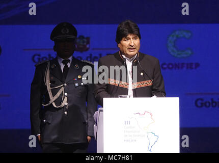 Lima, Peru. 13th Apr, 2018. Bolivian President Evo Morales (Front) speaks at the third Business Summit of the Americas in Lima, Peru, April 13, 2018. The Business Summit of the Americas was opened on Thursday, ahead of the eighth Summit of the Americas, scheduled for Friday and Saturday. Credit: Xu Rui/Xinhua/Alamy Live News Stock Photo