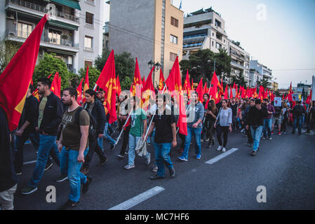 Athens, Greece. 13th Apr, 2018. Protesters holding flags and placards, march towards the American Embassy.Anti-war concentration by various social communities. With slogans such as ''The navy should leave the Aegean and the Mediterranean sea'' and ''Yes to Friendship and Solidarity of People'' after a march, hundreds of protesters arrived outside the US Embassy in Athens. Credit: Vangelis Evangeliou/SOPA Images/ZUMA Wire/Alamy Live News Stock Photo