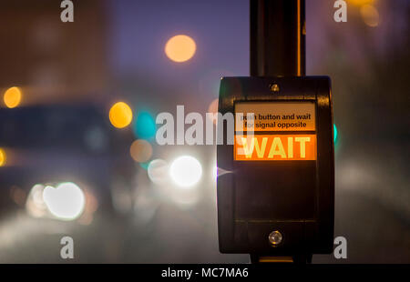 Pedestrian call button at a crossing in the UK. Stock Photo