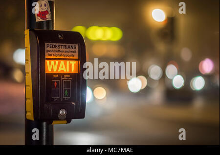 Pedestrian call button at a crossing in the UK. Stock Photo