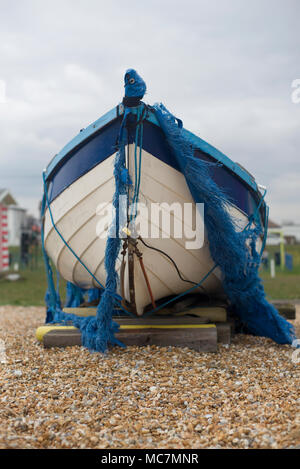 Boat on a shingle beach Stock Photo