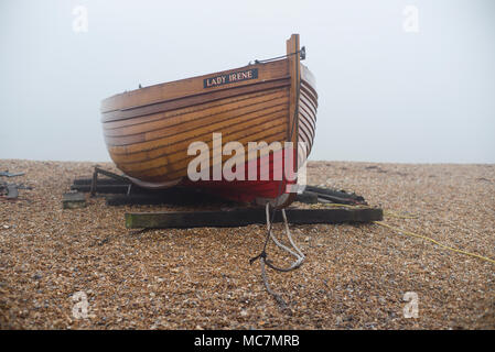 Boat on a shingle beach Stock Photo