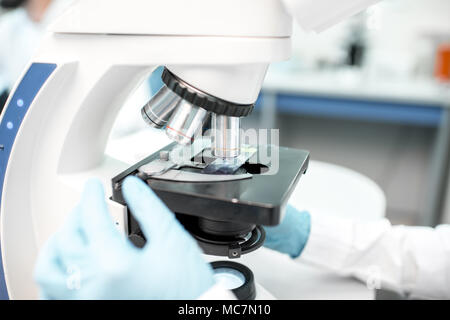 Close-up view on the microscope with test sample at the laboratory Stock Photo