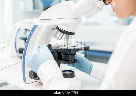 Close-up view on the microscope with test sample at the laboratory Stock Photo
