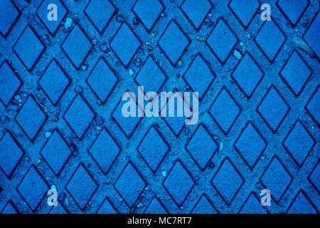 Ultra blue colored Wet Iron Background, rusty texture, cracked surface. Stock Photo