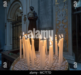 Votive or Prayer candles in roman catholic church Stock Photo