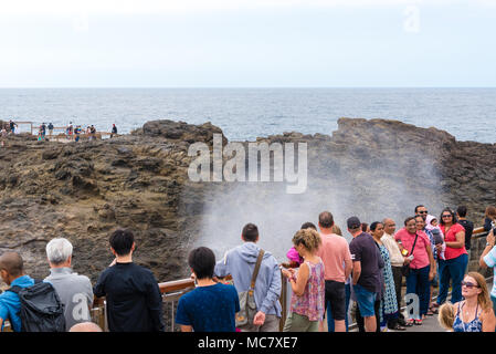 Kiama, NSW, Australia-March 31, 2018: Tourists visiting Kiama Blowhole, one of the largest blowholes in the world, a sea-cliff cavern that spouts seaw Stock Photo