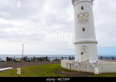 Kiama, NSW, Australia-March 31, 2018: Tourists visiting Kiama Blowhole, one of the largest blowholes in the world and the lighthouse Stock Photo