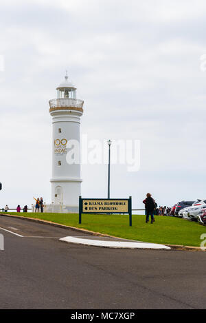 Kiama, NSW, Australia-March 31, 2018: Tourists visiting Kiama Blowhole, one of the largest blowholes in the world and the lighthouse Stock Photo