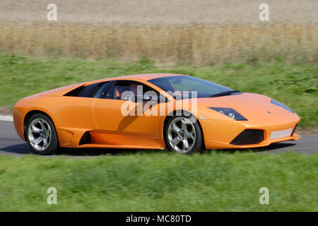 Orange Lamborghini Murcielago driving fast