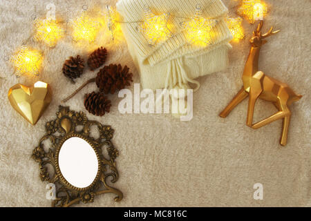 Empty wooden photo frame over cozy and warm fur carpet. For photography montage. Top view Stock Photo