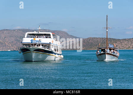 Ferry boat on the Gulf of Mirabello off the Cretan town of Agios Nikolaos, Crete, Greece, 2017. Returning from Spinalonga Island. Stock Photo