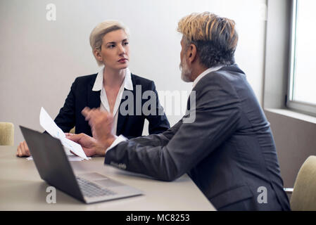 Business woman talking with financial advisor Stock Photo