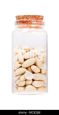 Peeled salted peanut in a glass bottle with cork stopper, isolat Stock Photo