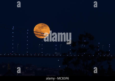 Super Blue Blood Moon Behind Bosphorus Bridge in Istanbul City, Turkey Stock Photo