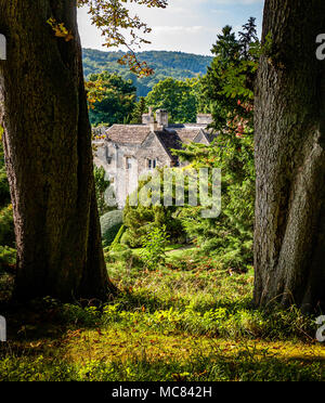 View from the upper paths of the Peto Garden over Iford Manor near Bath in Wiltshire UK Stock Photo
