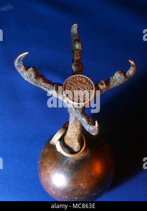 Witchcraft Arabic coin used as amulet and carried in the talons of a