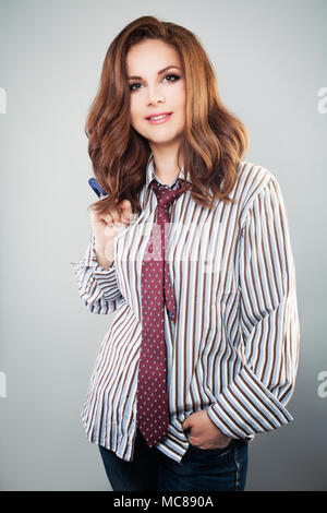 Cute Woman in Shirt and Tie. Smart Businesswoman Stock Photo