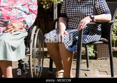 old womans is having wearable device smart watch in care home retirement house. Stock Photo