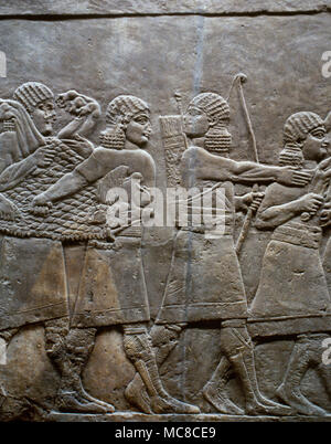 Palace  of Ashurbanipal, Nineveh. Iraq. Relief, return of the hunters. Upper Mesopotamia. Neo-Assyrian Empire, 7th century BC. British Museum. London, United Kingdom. Stock Photo