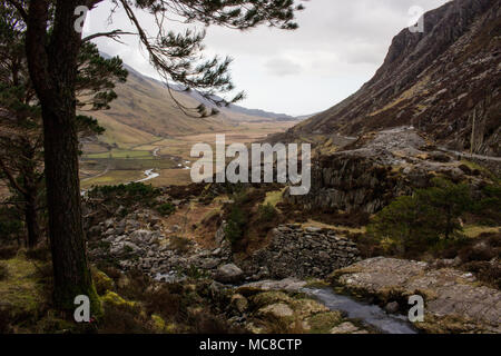 welsh snowdonia showing a waterfall which becomes the winding center stream in the middle of a welsh valley Stock Photo