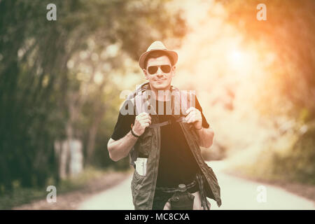 Caucasian young man backpacker travelling in local countryside Thailand Stock Photo