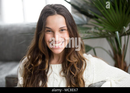 Headshot portrait of mestizo girl with white teeth and wide toothy smile, cheerful attractive young mulatto woman feeling happy looking at camera, bea Stock Photo