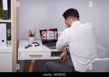Upset Businessman With Laptop Screen Showing Personal Files Encrypted Text Stock Photo