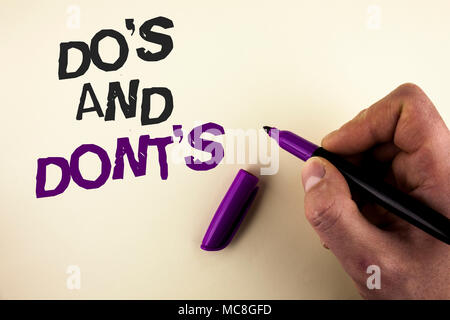 Conceptual hand writing showing Do'S And Don'Ts. Business photo showcasing What can be done and what cannot be knowing right wrong written by Man plai Stock Photo