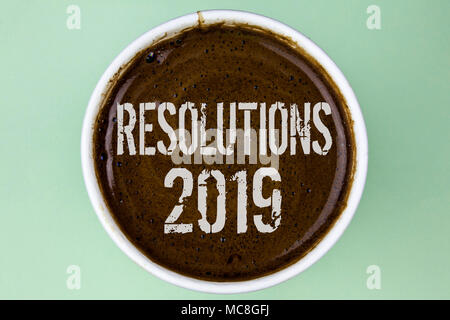 Word writing text Resolutions 2019. Business concept for Positive reinforcement personal improvent corporate goals written Coffee in a Cup the plain b Stock Photo