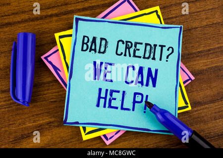 Handwriting text writing Bad Credit Question We Can Help Motivational Call. Concept meaning achieve good debt health written Sticky note paper wooden  Stock Photo