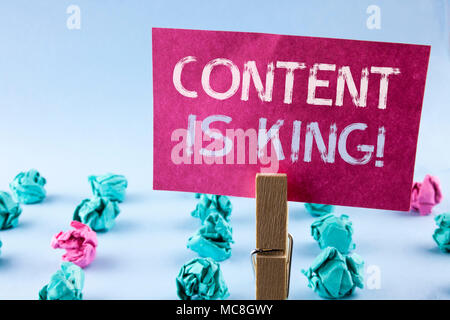 Word writing text Content Is King Motivational Call. Business concept for Strategy online internet digital seo written Pink Sticky Note Paper holding  Stock Photo