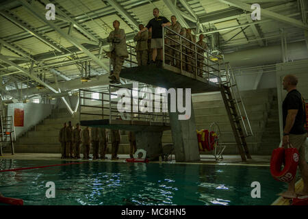 A recruit from India Company, 3rd Recruit Training Battalion, jumps off a platform during the Water Survival Basic Qualification at Marine Corps Recruit Depot San Diego, March 27. After successfully jumping, recruits swim to the next portion of the test. Annually, more than 17,000 males recruited from the Western Recruiting Region are trained at MCRD San Diego. India Company is scheduled to graduate May 25. Stock Photo