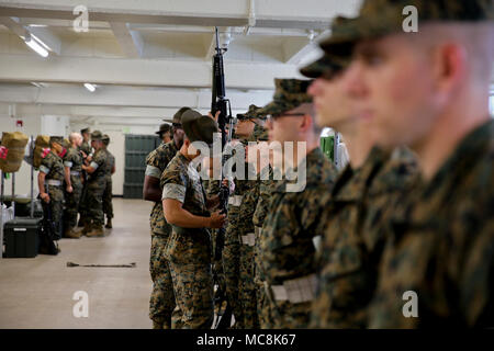 Drill instructors with Delta Company, 1st Recruit Training Battalion, inspect recruits at Marine Corps Recruit Depot San Diego, March 29. Drill instructors test recruits to see how much knowledge they’ve retained thus far in recruit training. Annually, more than 17,000 males recruited from the Western Recruiting Region are trained at MCRD San Diego. Delta Company is scheduled to graduate June 1. Stock Photo