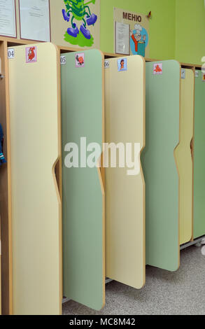 Gadjievo, Russia - January 16, 2013: Open wooden lockers in the changing room of the kindergarten Stock Photo