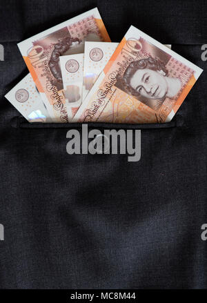 Ten pound notes in back pocket Stock Photo