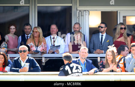 Eleanor Tomlinson (far left) Paddy McGuinness and his wife Christine McGuinness (right) watch the action during Grand National Day of the 2018 Randox Health Grand National Festival at Aintree Racecourse, Liverpool. Stock Photo