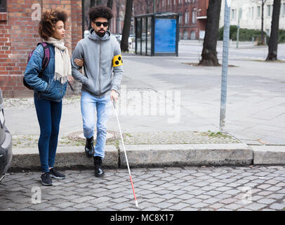 Close-up Of A Thief's Hand Stealing Purse From Backpack Stock Photo