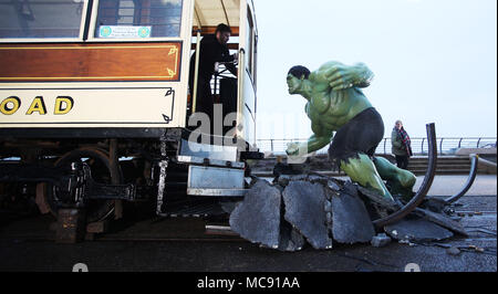 The Hulk stops traffic in Blackpool as he arrives with a bang in a groundbreaking stunt by Madame Tussauds Blackpool.  The spectacular scene which saw the green Avenger appear to dramatically stop a vintage tram in its tracks was created by Madame Tussauds Blackpool to mark the launch of the new Marvel Superheroes area, where The Hulk will be joined by his fellow Avengers Thor and Spider-man among others in a £1million, 5,501 square foot addition to the popular attraction, which opens next Friday (23March18).  Featuring: The Hulk Where: Blackpool, United Kingdom When: 15 Mar 2018 Credit: Joe P Stock Photo