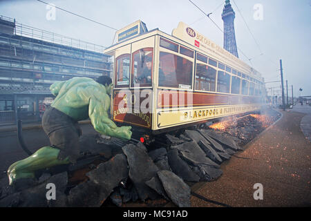 The Hulk stops traffic in Blackpool as he arrives with a bang in a groundbreaking stunt by Madame Tussauds Blackpool.  The spectacular scene which saw the green Avenger appear to dramatically stop a vintage tram in its tracks was created by Madame Tussauds Blackpool to mark the launch of the new Marvel Superheroes area, where The Hulk will be joined by his fellow Avengers Thor and Spider-man among others in a £1million, 5,501 square foot addition to the popular attraction, which opens next Friday (23March18).  Featuring: The Hulk Where: Blackpool, United Kingdom When: 15 Mar 2018 Credit: Joe P Stock Photo