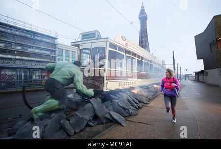 The Hulk stops traffic in Blackpool as he arrives with a bang in a groundbreaking stunt by Madame Tussauds Blackpool.  The spectacular scene which saw the green Avenger appear to dramatically stop a vintage tram in its tracks was created by Madame Tussauds Blackpool to mark the launch of the new Marvel Superheroes area, where The Hulk will be joined by his fellow Avengers Thor and Spider-man among others in a £1million, 5,501 square foot addition to the popular attraction, which opens next Friday (23March18).  Featuring: The Hulk Where: Blackpool, United Kingdom When: 15 Mar 2018 Credit: Joe P Stock Photo