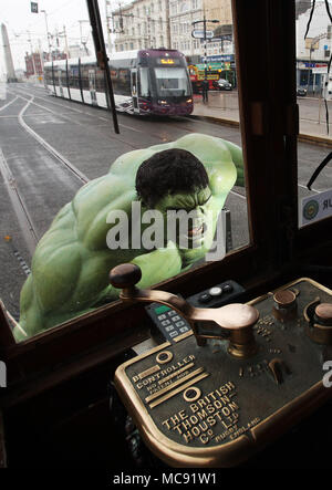 The Hulk stops traffic in Blackpool as he arrives with a bang in a groundbreaking stunt by Madame Tussauds Blackpool.  The spectacular scene which saw the green Avenger appear to dramatically stop a vintage tram in its tracks was created by Madame Tussauds Blackpool to mark the launch of the new Marvel Superheroes area, where The Hulk will be joined by his fellow Avengers Thor and Spider-man among others in a £1million, 5,501 square foot addition to the popular attraction, which opens next Friday (23March18).  Featuring: The Hulk Where: Blackpool, United Kingdom When: 15 Mar 2018 Credit: Joe P Stock Photo