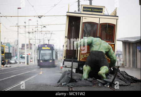 The Hulk stops traffic in Blackpool as he arrives with a bang in a groundbreaking stunt by Madame Tussauds Blackpool.  The spectacular scene which saw the green Avenger appear to dramatically stop a vintage tram in its tracks was created by Madame Tussauds Blackpool to mark the launch of the new Marvel Superheroes area, where The Hulk will be joined by his fellow Avengers Thor and Spider-man among others in a £1million, 5,501 square foot addition to the popular attraction, which opens next Friday (23March18).  Featuring: The Hulk Where: Blackpool, United Kingdom When: 15 Mar 2018 Credit: Joe P Stock Photo